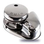 The above-deck unit of a Muir VR2200 vertical windlass, showing the rope-chain gypsy and polished stainless steel finish.