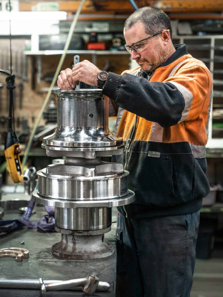 Precise industrial engineering work on high-performance turbine component at Muir Engineering workshop.