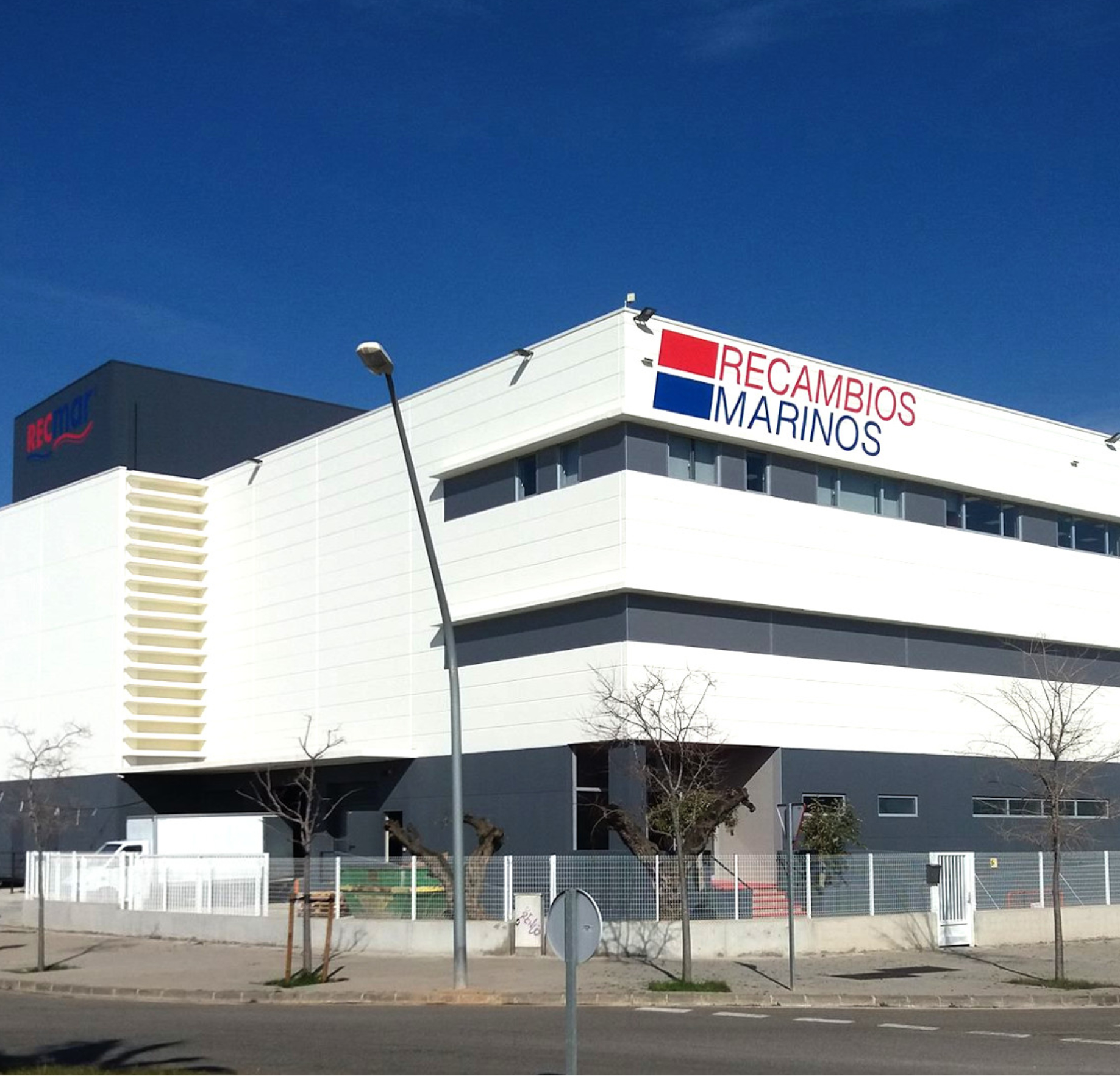 The exterior of the Recambios Marinos building, a Spanish distributor for marine parts.